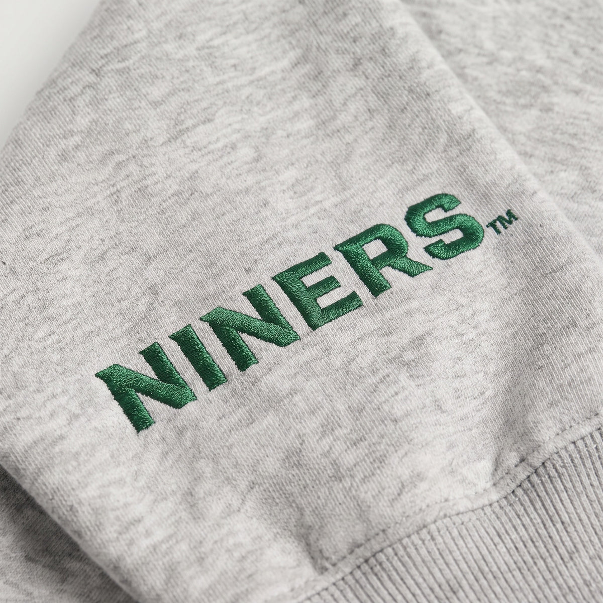 UNC Charlotte Sideline Mockneck sleeve logo detail